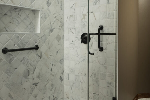 Ag interiors Grafton primary bathroom remodel marble and limestone tile